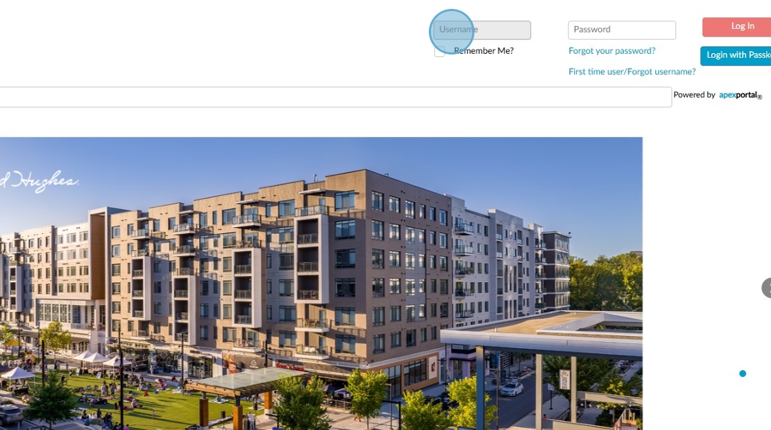Screenshot of a login page with fields for username and password above an image of a multi-story apartment complex with shops and a courtyard.